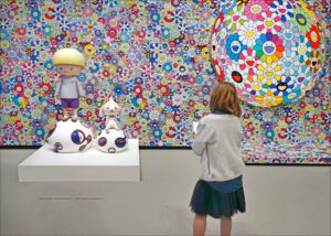 Takashi Murakami ‘s artwork : colourful sunflowers of all sizes are scrawled on a wall.