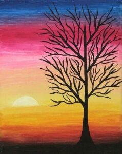 Dead trees on blue pink yellow background