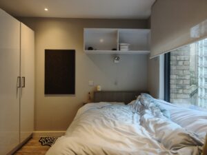 Here's a picture of a corner of my room. The picture shows my bed, cupboards and some miscellaneous items.