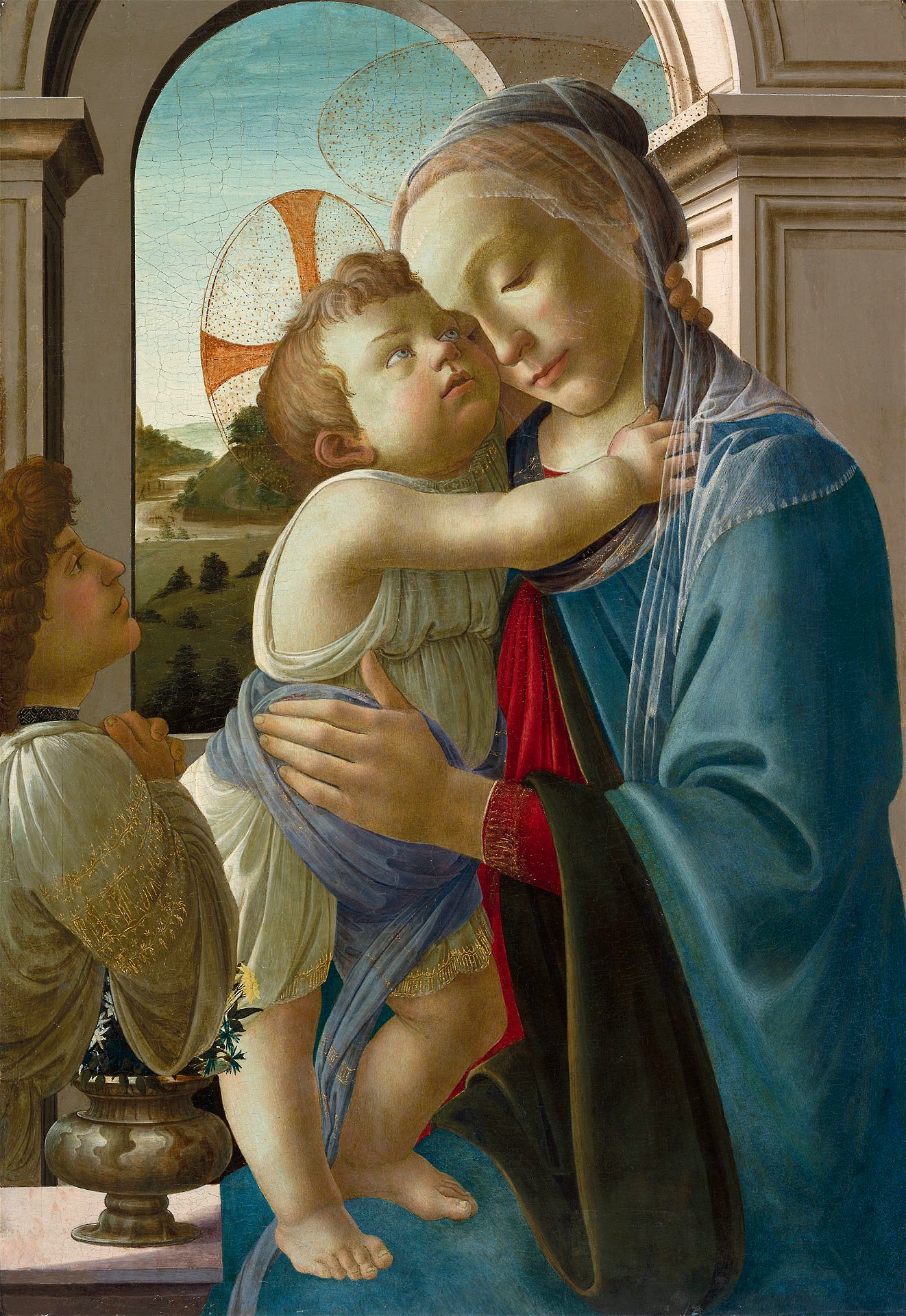A Renaissance painting of the Madonna holding Christ, with a young man in prayer beside them.