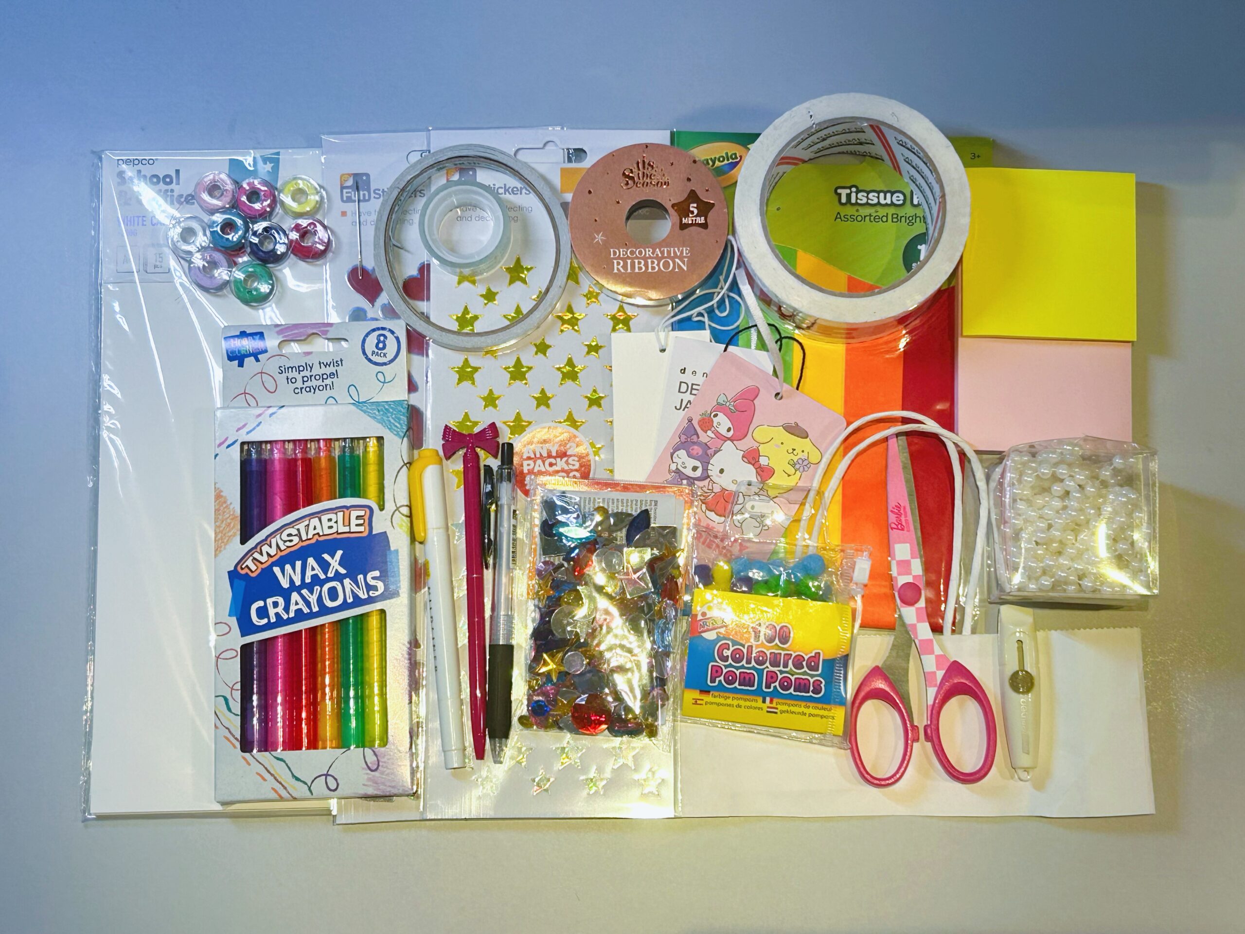 This picture shows the tools and materials that need to be prepared, including white paper, colored paper, tape, ribbons, stickers, needles, scissors, etc