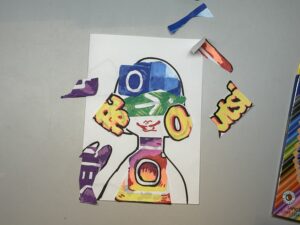 Paste the selected elements on the corresponding part of the outline on the paper.