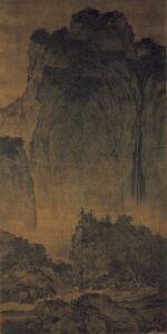This is a tall landscape painting. Its vertical format—tall with a narrow width—is a specific format of Chinese painting from the Northern Song Dynasty and beyond, a distinctive feature of Chinese civilization. The entire painting is divided into three sections from bottom to top. At the bottom, several people ride donkeys along a path at the foot of the mountain, accompanied by tall trees with thick and gnarled trunks. The middle section consists of layer upon layer of rock formations, worn smooth by water and wind, with numerous shadows. The top section is dominated by a massive, upright mountain peak that occupies nearly half the frame, towering so high it seems to touch the sky. There is no clear direction of light; the light and dark tones of the painting are mainly conveyed through the depth of ink wash. The higher up the mountain, the lighter the ink, as if shrouded in mist. Though there is no sunlight in the painting, it exudes a profound and serene atmosphere—humans appear insignificant against the vastness of the mountains. The composition is "top-heavy," guiding the viewer’s gaze from bottom to top, as if transiting from the human world to the realm of heaven and earth.