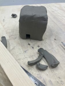 A top heavy ceramic house.