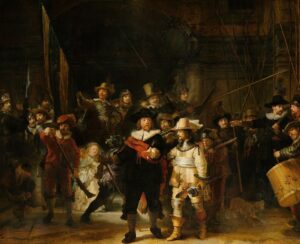 This painting depicts a Dutch militia unit setting out on patrol. It is extremely large—about twice the height of an average person and wide enough for someone to take more than ten steps. The most striking feature is two figures: the captain in the front, dressed in black and wearing a broad-brimmed hat, stretches his hand forward as if directing the team. Beside him, his deputy is clad in bright yellow, bathed in sunlight that makes him stand out vividly. Light shines obliquely from the upper left of the frame, illuminating their faces and clothing while darkening the figures behind them. Around them stand more than a dozen soldiers—some holding guns, others adjusting the flag, and a few beating drums. The background is blurred and dim, emphasizing the two front figures. The overall atmosphere is tense yet dynamic, as if the unit is just about to depart. The key light element is a beam of golden light piercing through the darkness, making the figures appear as if they are stepping out of the shadows.