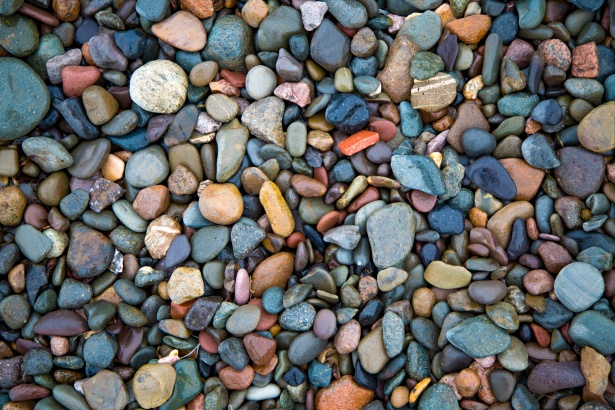 From a bird's-eye view, the ground is entirely covered by a vibrant tapestry of multicoloured stones.