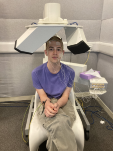 Carstens AG501 articulograph with a subject attached to sensors seated within the equipment 