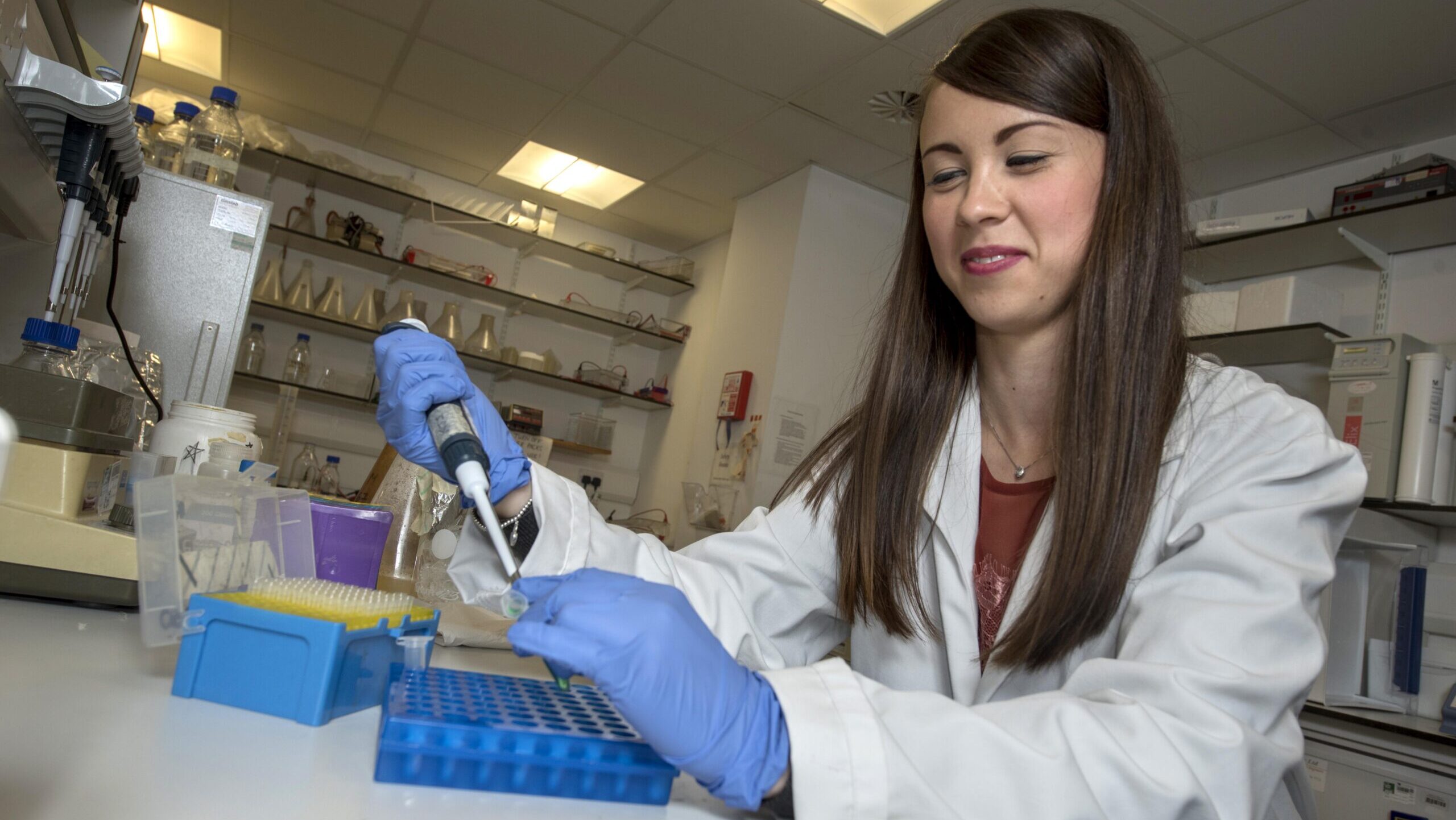 Scientist pipetting in a laboratory