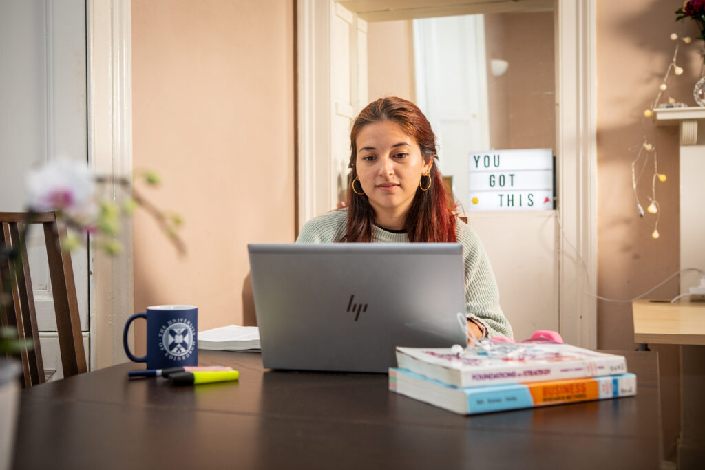 Woman working on a laptop at home