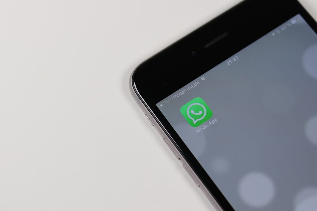 A phone with a WhatsApp icon.