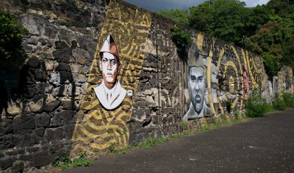 mural artwork of faces painted on a wall