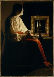 An early seventeenth century paintin gof a young woman with a skull on her lap sitting next to a mirror