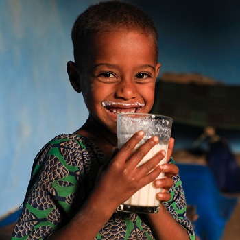 Ethiopian girl drinking milk (copyright ILRI/Apollo Habtamu)