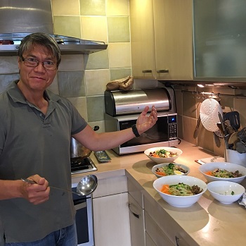 Richard Chin cooking in the kitchen