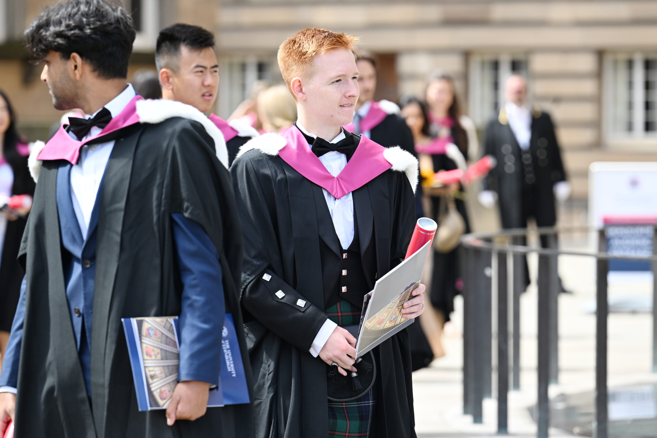 Graduates in their gowns outside McEwan Hall