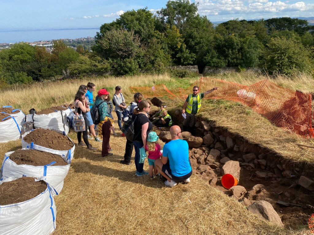 A photo from one of the Open Days featuring members of public at Dunsapie Hillfort