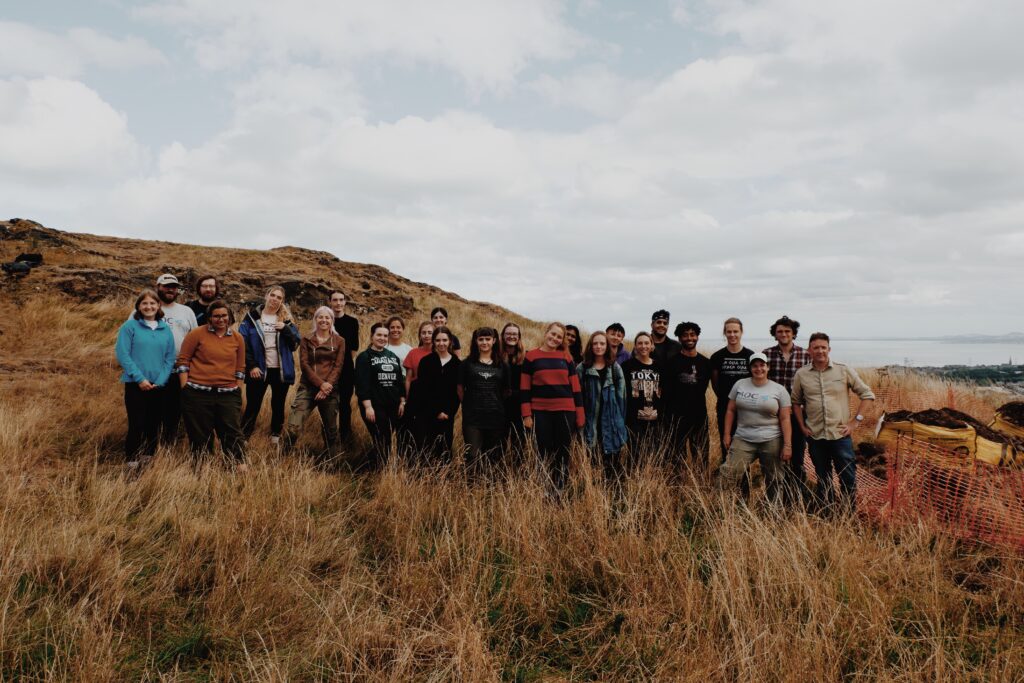 The Holyrood Archaeology team posing for a group photo at Dunsapie Hillfort