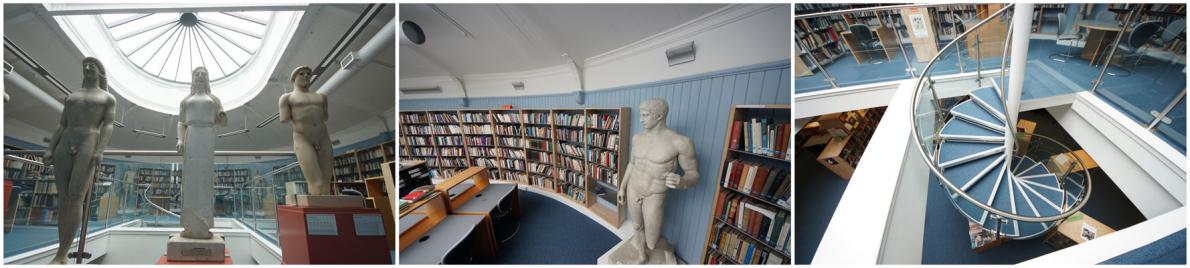 Student research rooms showing bookcases and statues around the s pace