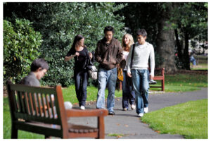 Students walking in the green of George Square