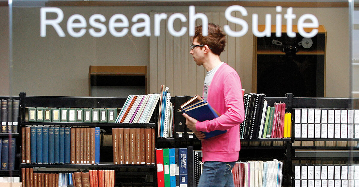 A student walks past the Research Suite at the University of Edinburgh.