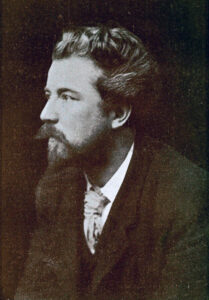 A black and white photograph of William Sharp taken in 1894. He has a long moustache and pointed beard.