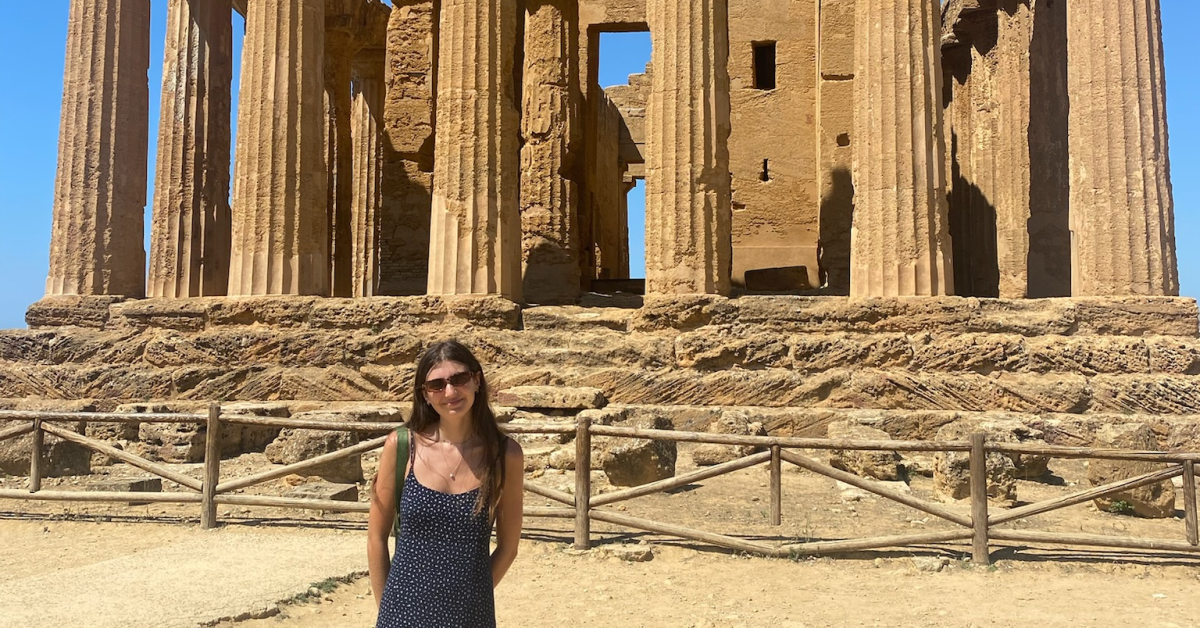 Person in front of an ancient building