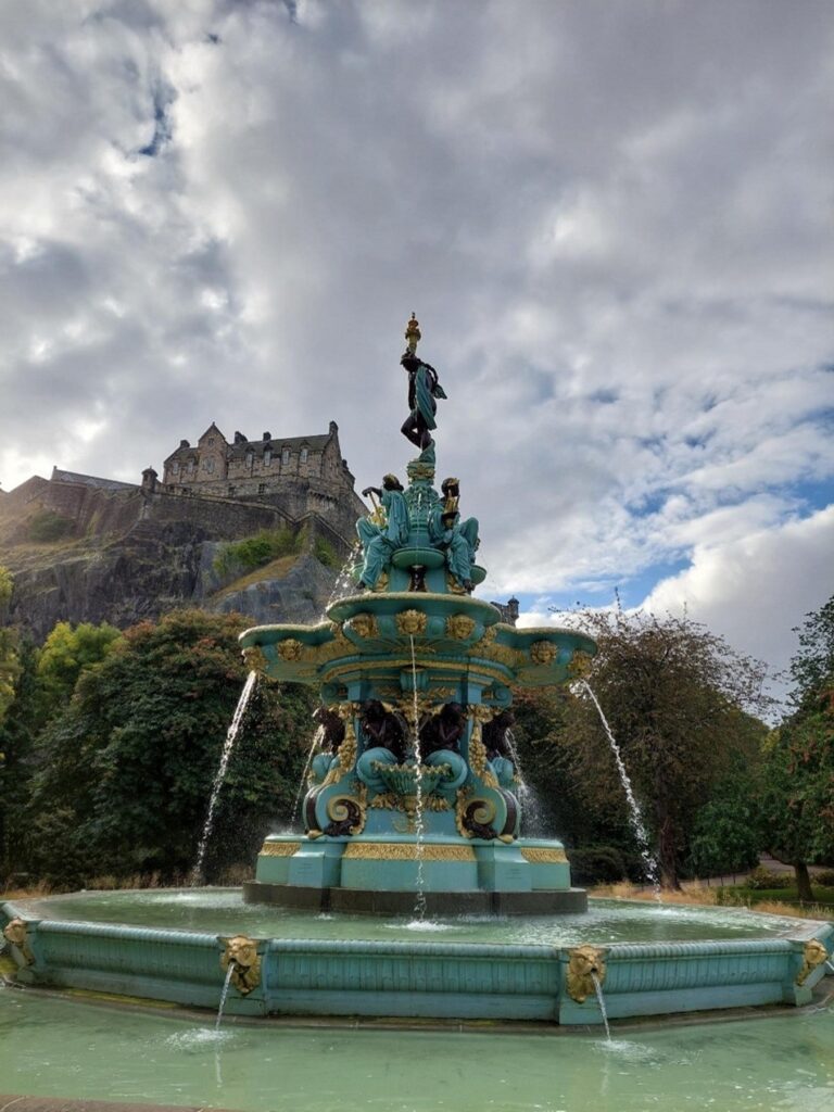 Ross Fountain in Princess Street Gardens with the Edinburgh Castle in the background.