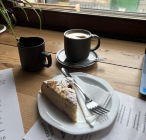 A cup of coffee and cake in a cafe