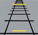 Visual Illusion, perspective of the train tracks makes the 2 yellow lines appear different sizes
