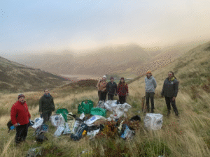 Photograph showing participants at a tree planting event in the Scottish Borders