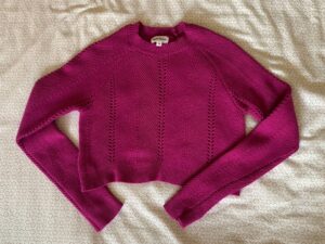 Red jumper from charity shop