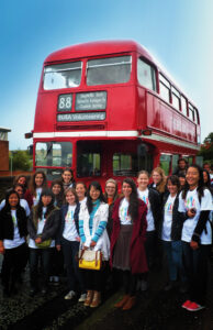 EUSA volunteers pictuered in front of EUSA volunteer bus