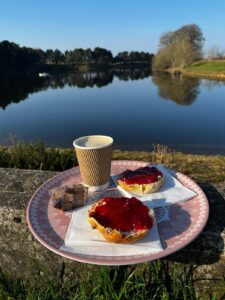 Photo of scone and coffee outside Clubbiedeans