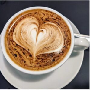 A coffee decorated with a love heart