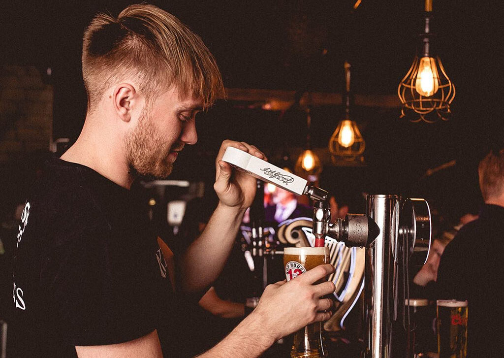 Rory working at a bar