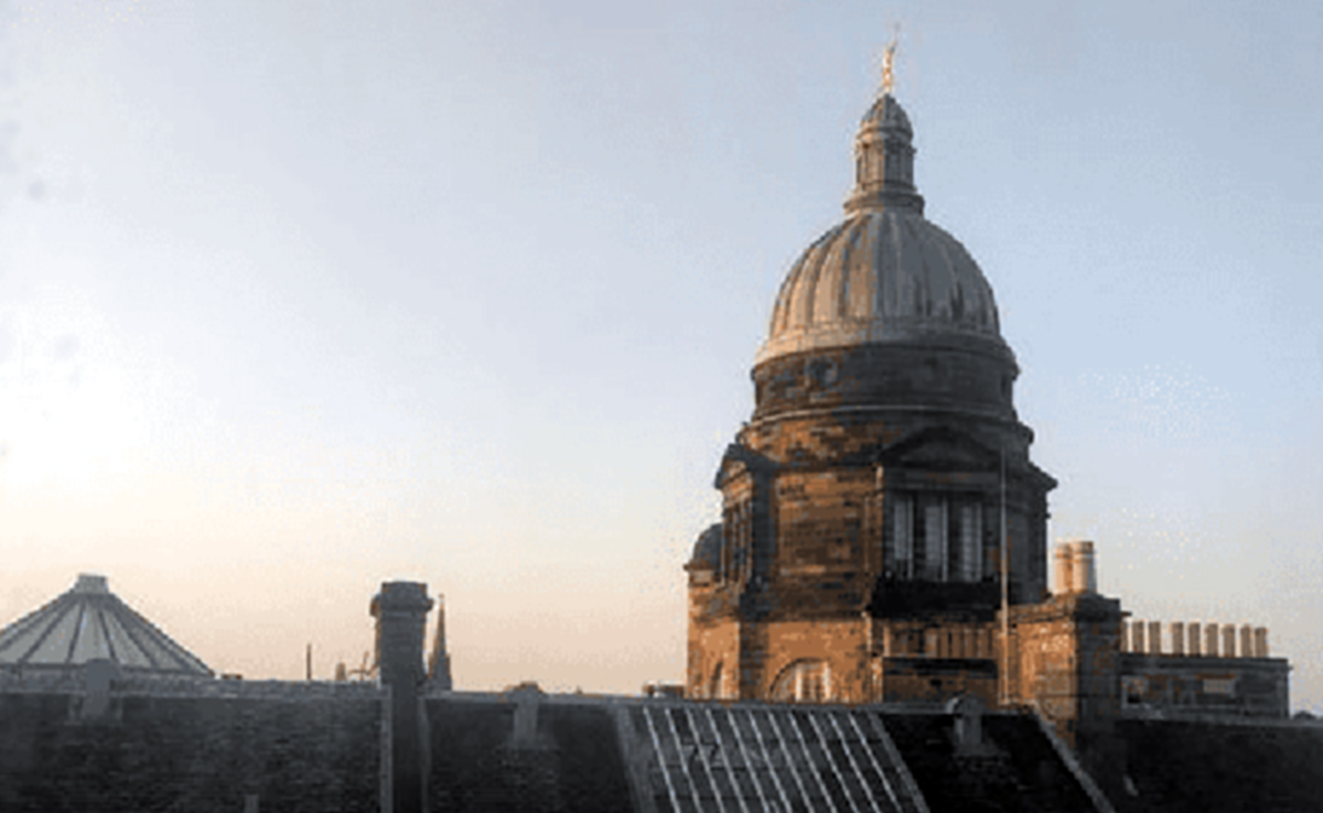 View of the sun shining on the dome at Old College.