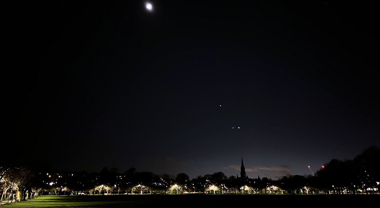 Few of the meadows and sky on a dark night.