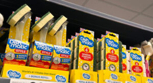 Dishmatic dish cleaning wand and refill sponges on a supermarket shelf.