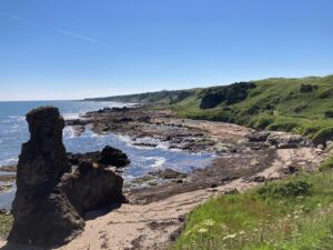 A large rock at a coast.