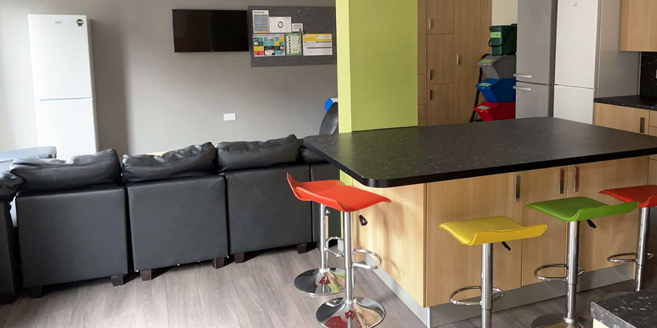 View of a student kitchen with colourful stools