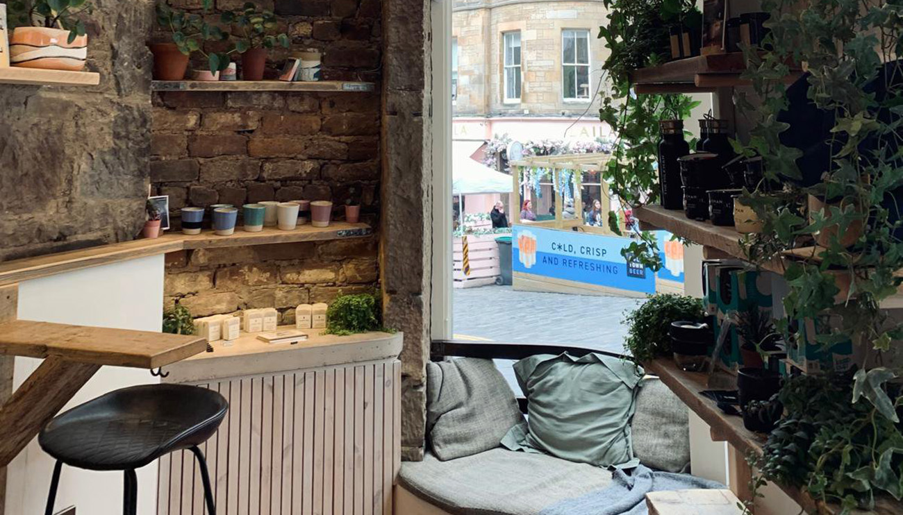 Inside a coffee shop, a view of a window seat.