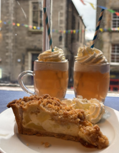 Two glasses of Butterbeer and a cake