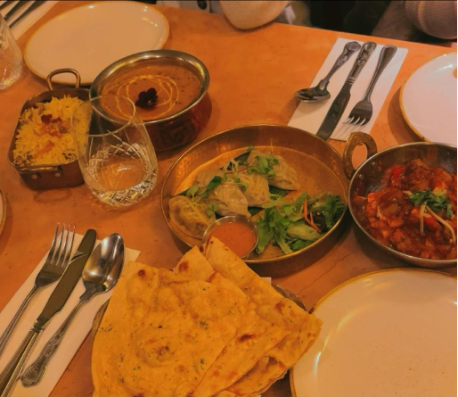 dinner at Solti, a Nepalese-Indian resturant. mix of things, biryani, paneer butter masala, steamed dumplings, and naan. 