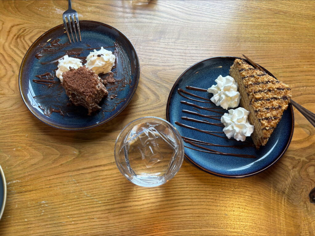 Two plates with cakes on
