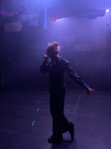 Student Amy performing on stage in a production of Guys and Dolls