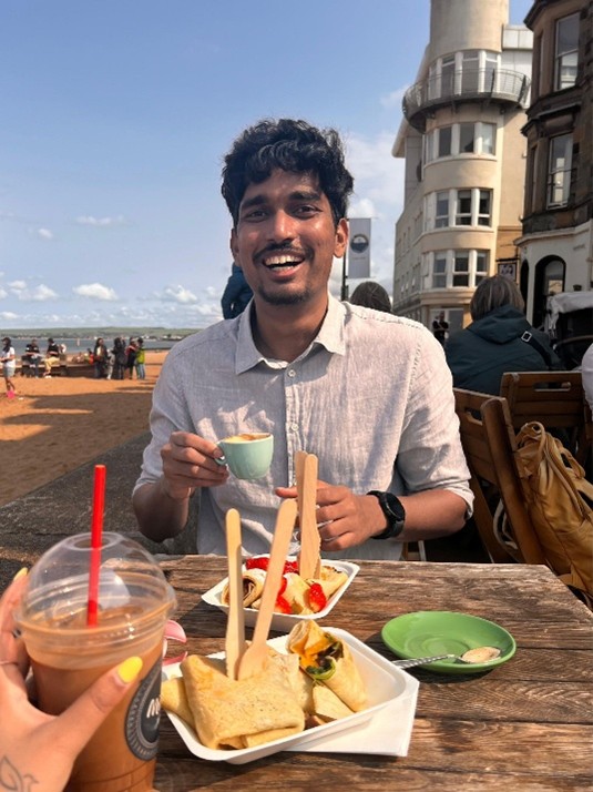 Omkar sat at a restaurant eating