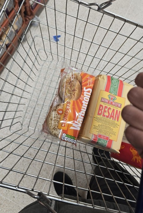 A shopping basket filled with crumpets and rice