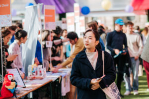 A student walks through activities fair during Welcome Week