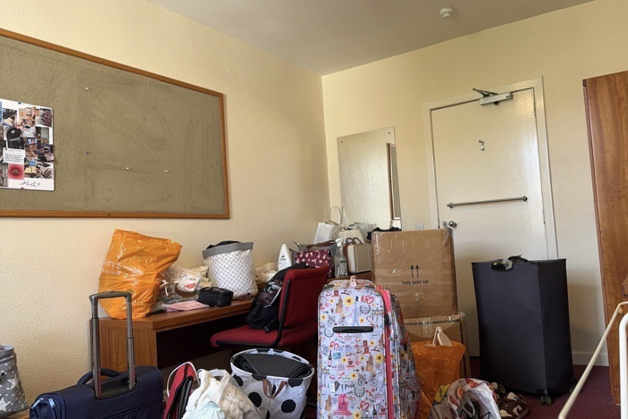 A room with luggage and boxes.