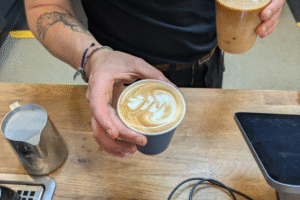 A coffee with a decorative design.